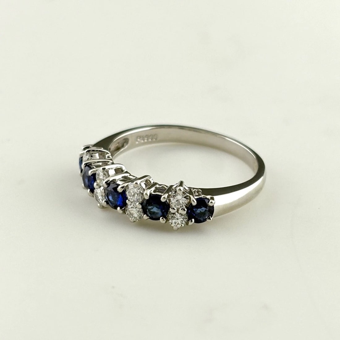 SAPPHIRE DESIGN RING PLATINUM MELEE DIAMOND RING: Sapphire Design Ring Platinum Melee Diamond Ring Brand: Unbranded Type/Style: Ring Material: Pt900, Main Stone Sapphire /Secondary Stone:Natural Color: None Size: US7.5 to 8 Accessories: None