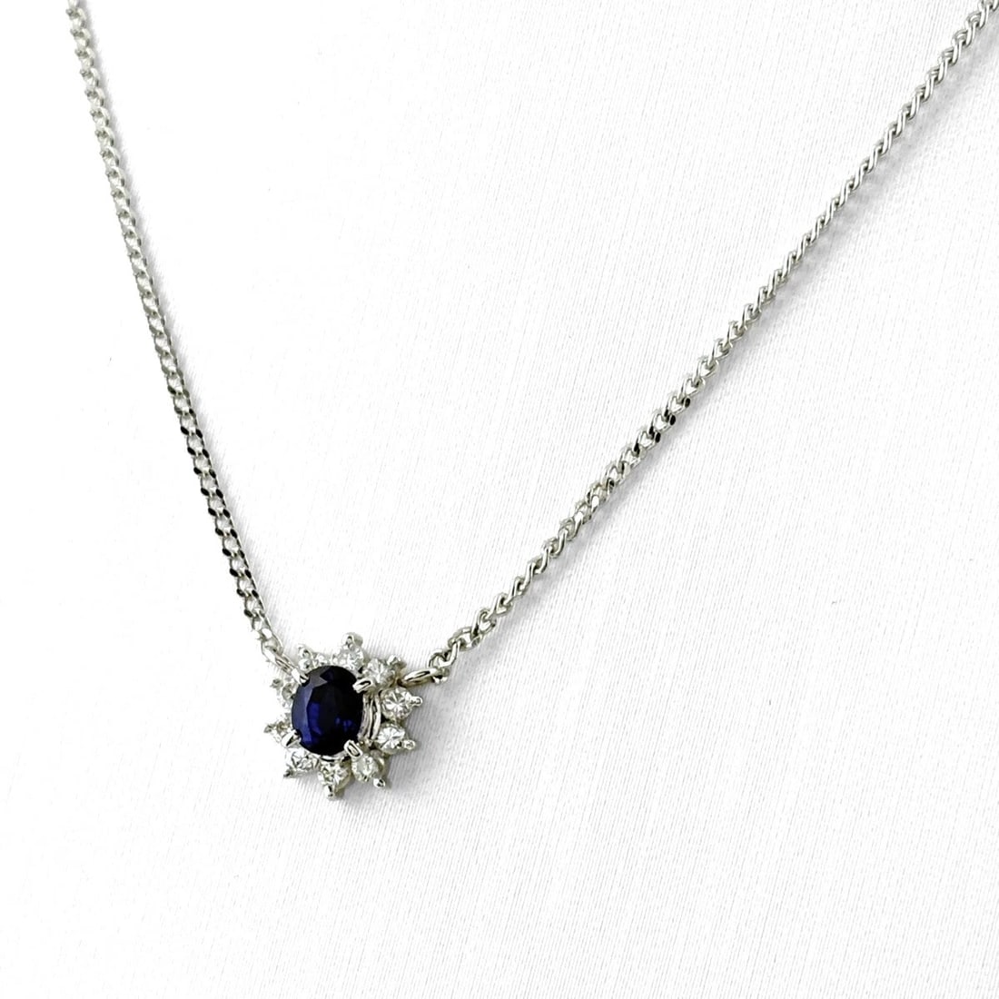 SAPPHIRE DESIGN PLATINUM PENDANT MELEE DIAMOND NECKLACE: Sapphire Design Platinum Pendant Melee Diamond Necklace Brand: Unbranded Type/Style: Necklace Material: Pt900, Main Stone Sapphire /Secondary Stone:Natural Color: None Size: 8.5x8.1mm(0.3")