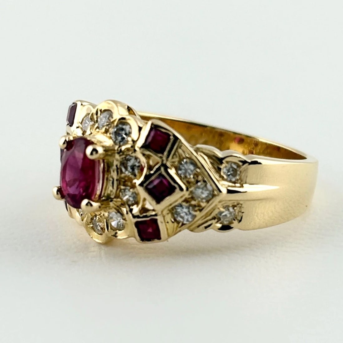 RUBY DESIGN RING YG MELEE DIAMOND RING: Ruby Design Ring Yg Melee Diamond Ring Brand: Unbranded Type/Style: Ring Material: 18K YG, Main Stone Ruby /Secondary Stone:Natural Color: YG Size: US6.5 Accessories: None Accessories Notice: When