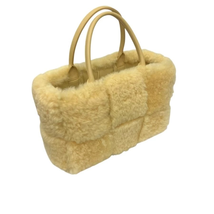 BOTTEGA VENETA BAG: MOUTON ARCO TOTE YELLOW: BOTTEGA VENETA Bag: Mouton Arco Tote Yellow Brand: BOTTEGA VENETA Type/Style: Tote Material: Exterior Material Fur Color: Exterior Color Yellow Size: (approx. W14.6 ? H8.7 ? D5.5 inch) Accessories: