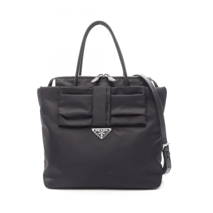 PRADA BAG: TESSUTO FIOCCO: PRADA Bag: TESSUTO FIOCCO Brand: PRADA Type/Style: Satchel/Top Handle Bag Material: Exterior Material Nylon / Leather Color: Exterior Color Black Size: (approx. W9.8 ? H10.6 ? D3.9 inch) Accessories: