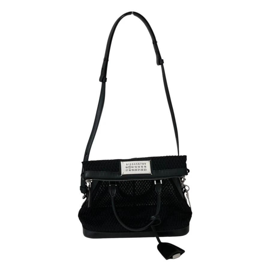 MAISON MARGIELA BAG: MESH: MAISON MARGIELA Bag: Mesh Brand: MAISON MARGIELA Type/Style: Top Handle Bag Material: Exterior Material Mesh Color: Exterior Color Black Size: (approx. W9.4?10.2 ? H10.6 ? D4.7 inch) Accessories: