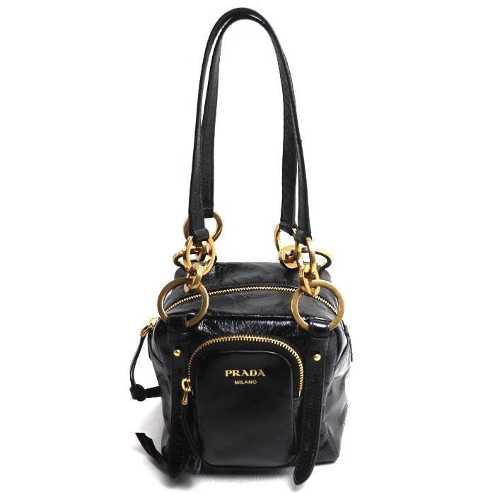 PRADA BAG: DANGLE BLACK: PRADA Bag: Dangle Black Brand: PRADA Type/Style: Top Handle Bag Material: Exterior Material Leather Color: Exterior Color Black Size: (approx. W5.9 ? H5.9 ? D5.1 inch) Accessories: None Ac