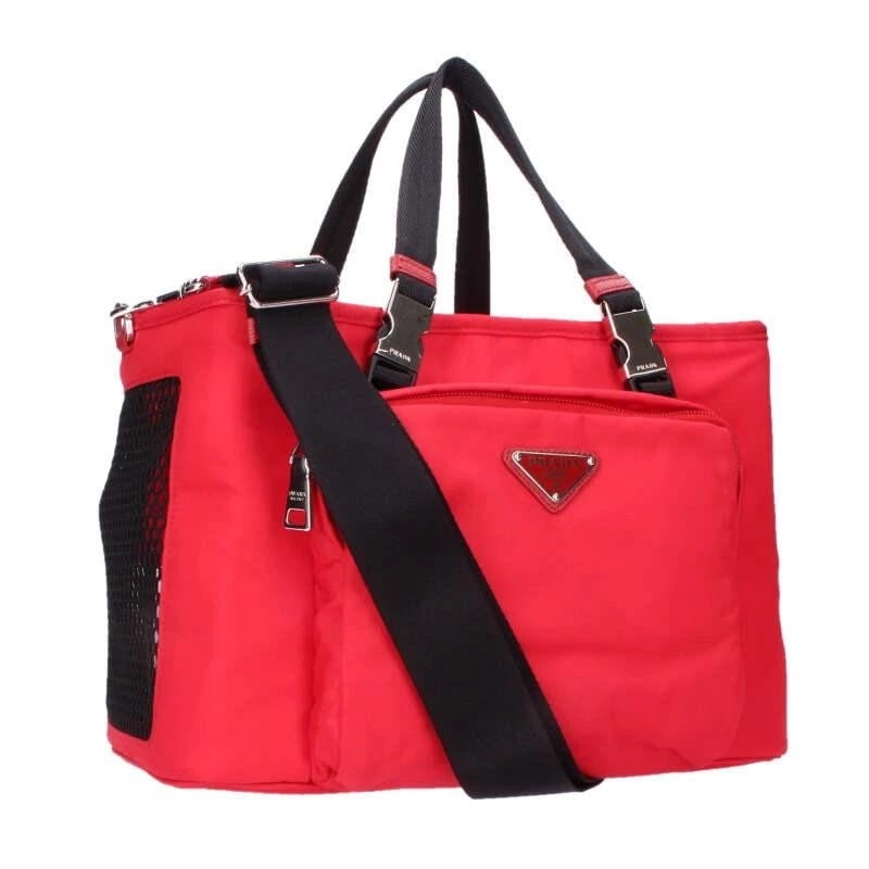 PRADA BAG: RE-NYLON TRIANGLE LOGO PET HANDBAG RED: PRADA Bag: Re-Nylon Triangle Logo Pet Handbag Red Brand: PRADA Type/Style: Tote Material: Exterior Material Nylon Color: Exterior Color Red Size: (approx. W10.2 ? H7.9 ? D6.9 inch) Accessories: None