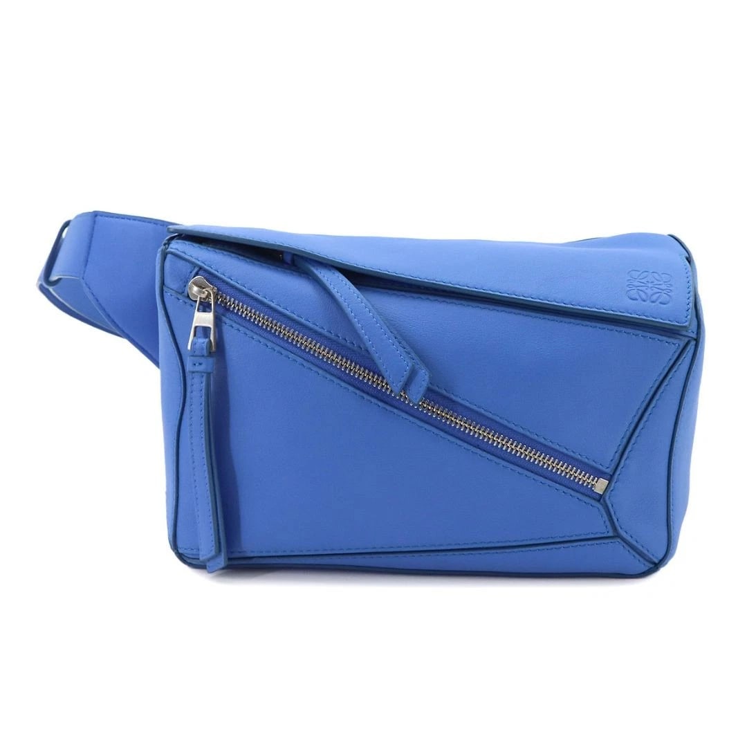 LOEWE PUZZLE BUMBAG LEATHER BODY BAG: LOEWE Puzzle Bumbag Leather Body Bag Brand: Loewe Type/Style: Belt Bag & Fanny Pack Material: Soft leather exterior with a herringbone pattern canvas lining Color: Seaside Blue Size: W24 ? H15.5 ? D10