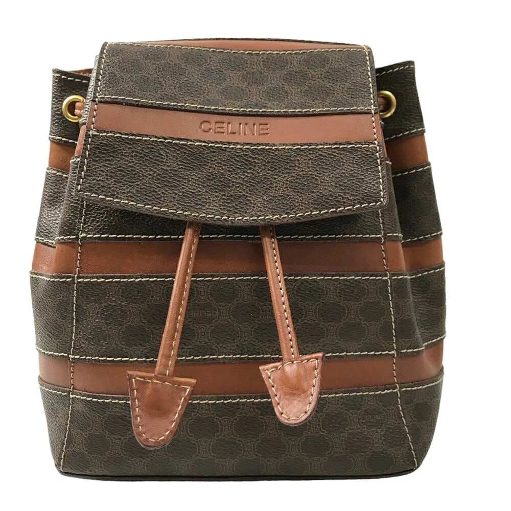 CELINE MINI BACKPACK MACADAM TRIOMPHE CANVAS BROWN LEATHER: CELINE Mini Backpack Macadam Triomphe Canvas Brown Leather Brand: CELINE Type/Style: Backpack Material: Leather / PVC Leather Color: Brown Size: Width: 7.48 inches (19 cm) Height: 8.66 inches (22 cm)