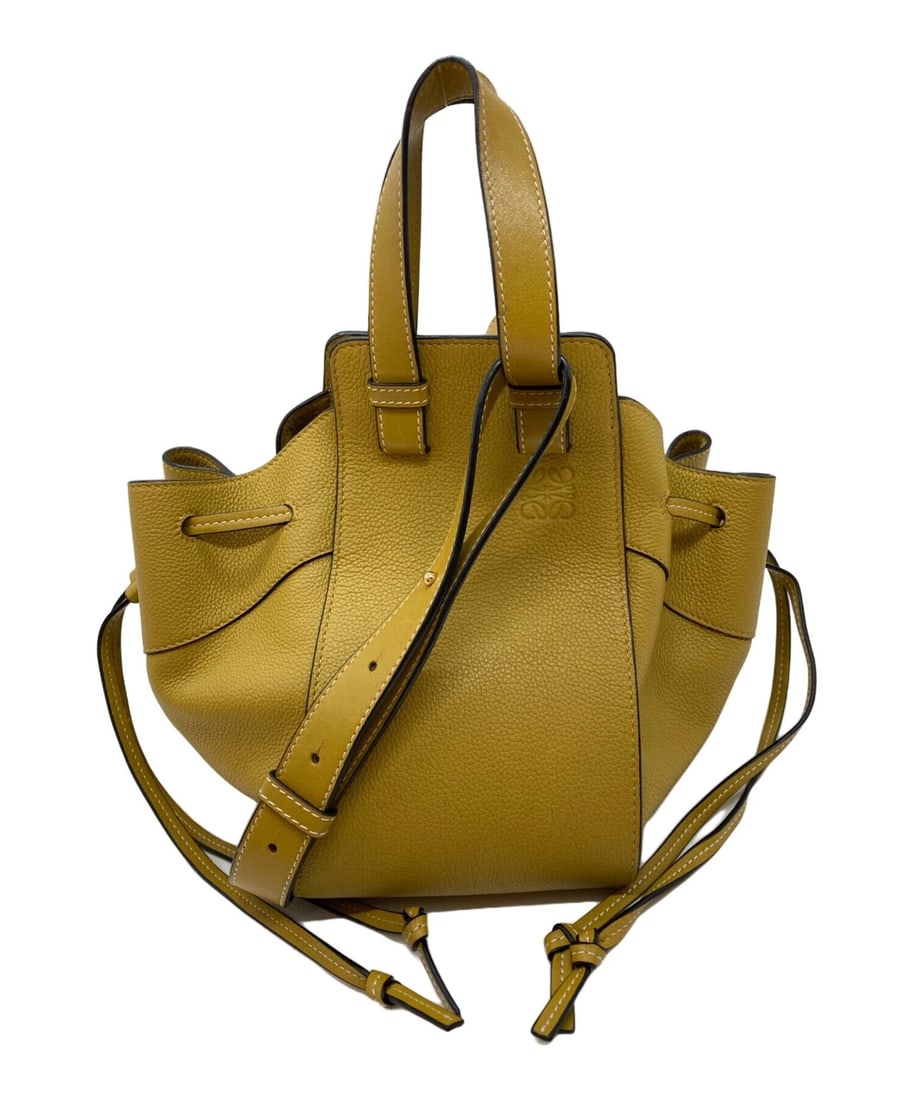 LOEWE HAMMOCK DRAWSTRING BAG: Loewe Hammock Drawstring Bag Brand: Loewe Type/Style: Drawstring Bag Material: None Color: Yellow Size: Height: approx. 23 cm (? 9.06 in) Width: approx. 27 cm (? 10.63 in) Depth (Gusset): approx. 24 c