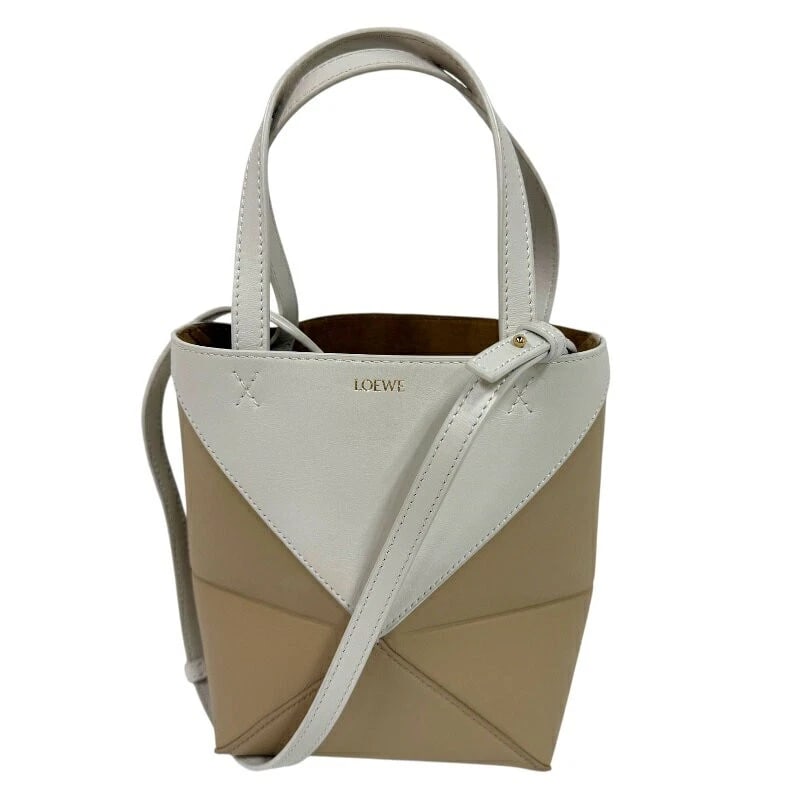 LOEWE TOTE MINI BAG PUZZLE FOLD CALF LEATHER: LOEWE Tote Mini Bag Puzzle Fold Calf Leather Brand: LOEWE Type/Style: Tote Material: Calfskin Color: Ivory Size: Width: approx. 16 cm Height: approx. 20 cm Depth: approx. 9 cm Accessories: None