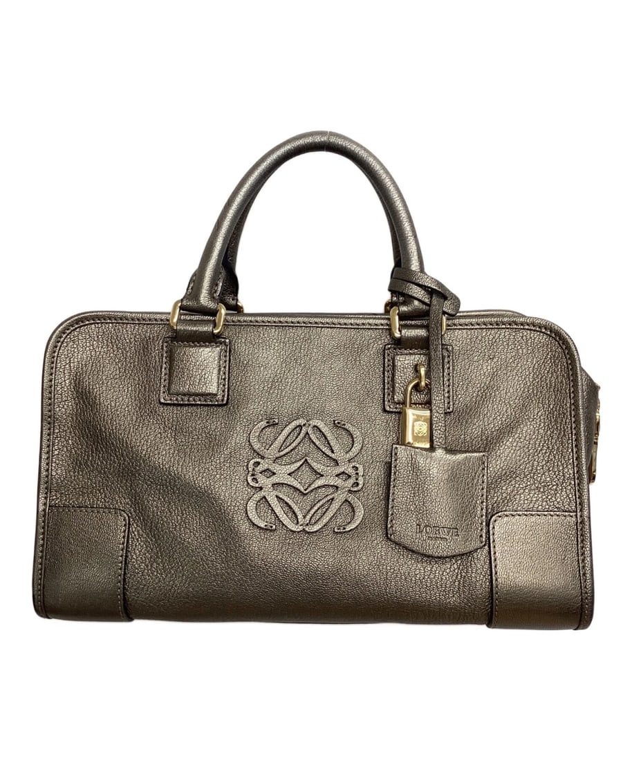 LOEWE TOP HANDLE BAG AMAZONA: Loewe Top Handle Bag Amazona Brand: Loewe Type/Style: Top Handle Bag Material: None Color: Silver Size: Height: approx. 16.0 cm (? 6.30 in) Width: approx. 29.2 cm (? 11.50 in) Depth (Gusset): approx. 