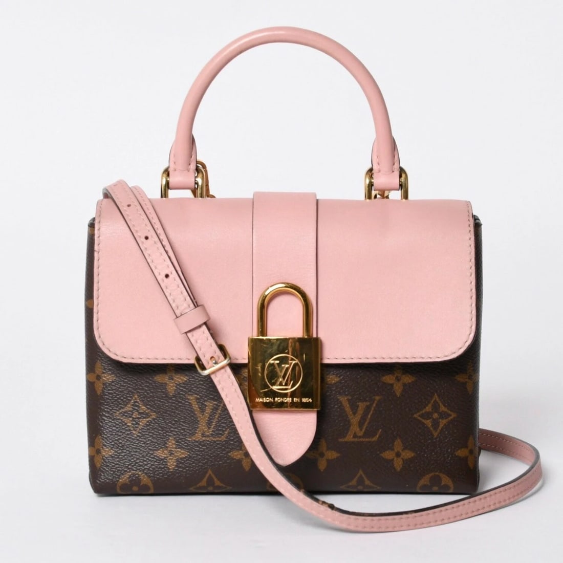 LOUIS VUITTON MONOGRAM ROCKY BB ROSE POUDRE PINK CROSSBODY BAG: Louis Vuitton Monogram Rocky BB Rose Poudre Pink Crossbody Bag Brand: Louis Vuitton Type/Style: Satchel/Top Handle Bag Material: PVC, Leather Color: Rose Poudre (Pink/Brown) Size: Approximately W 21cm