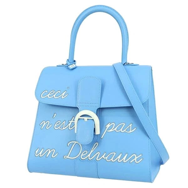 DELVAUX HANDBAG L'HUMOUR MM MAGRITTE: DELVAUx Handbag L'Humour MM Magritte Brand: Delvaux Type/Style: Hand Bag Material: Box Calf Leather Color: Blue / White Size: Width: approx. 11.02 in (28 cm) Height: approx. 9.45 in (24 cm) Depth: app