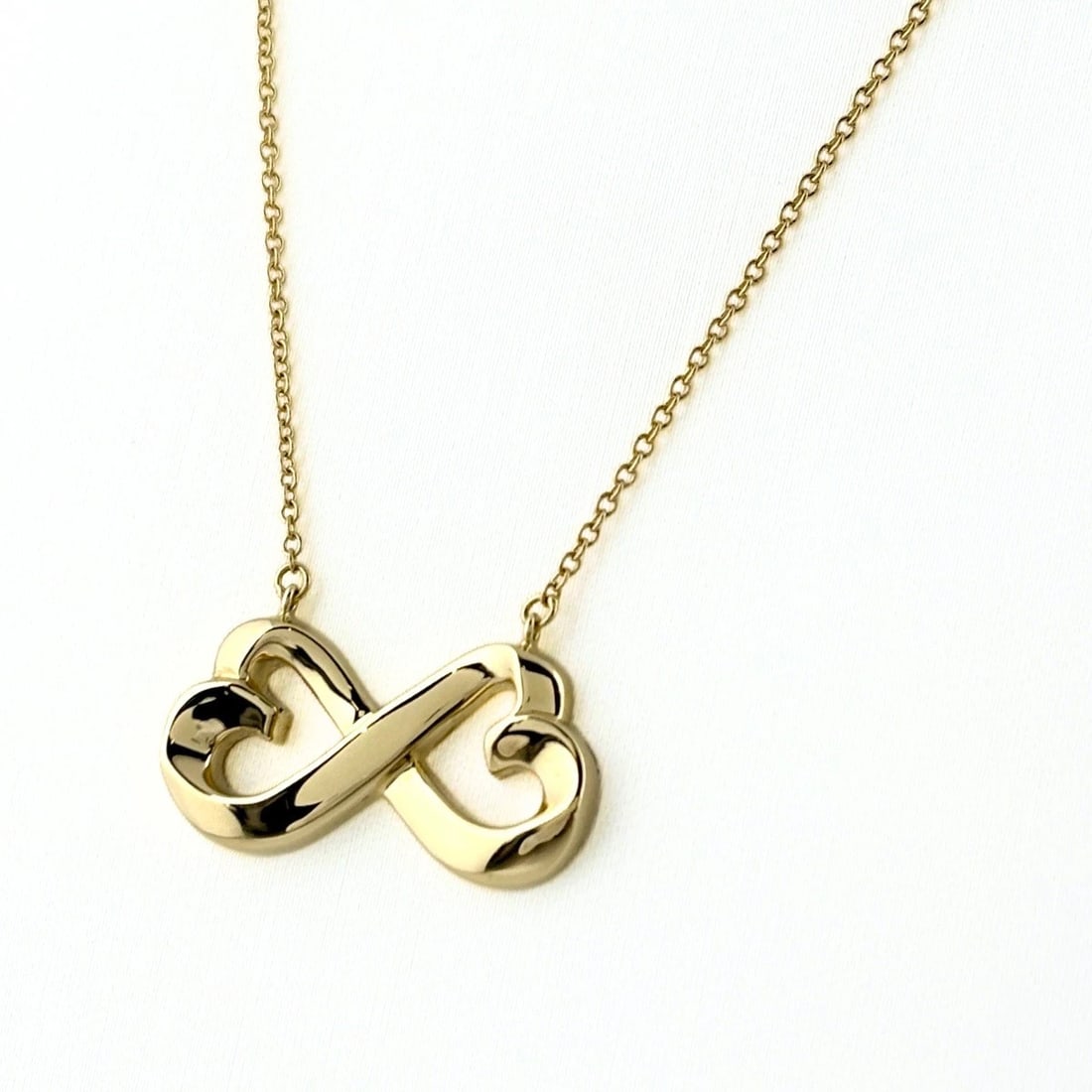 TIFFANY&CO. DOUBLE LOVING HEART NECKLACE YG PENDANT: Tiffany&Co. Double Loving Heart Necklace Yg Pendant Brand: TIFFANY&Co. Type/Style: Necklace Material: 750YG, Main Stone None Color: YG Size: 11.4x21.8mm(0.4") Accessories: None Accessories Notice: