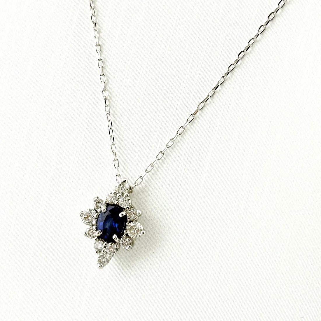 SAPPHIRE DESIGN NECKLACE WG PENDANT MELEE NECKLACE: Sapphire Design Necklace Wg Pendant Melee Necklace Brand: Unbranded Type/Style: Necklace Material: 18K WG, Main Stone Sapphire /Secondary Stone:Natural Color: WG Size: 12.2x9.3mm(0.5") Accessories: