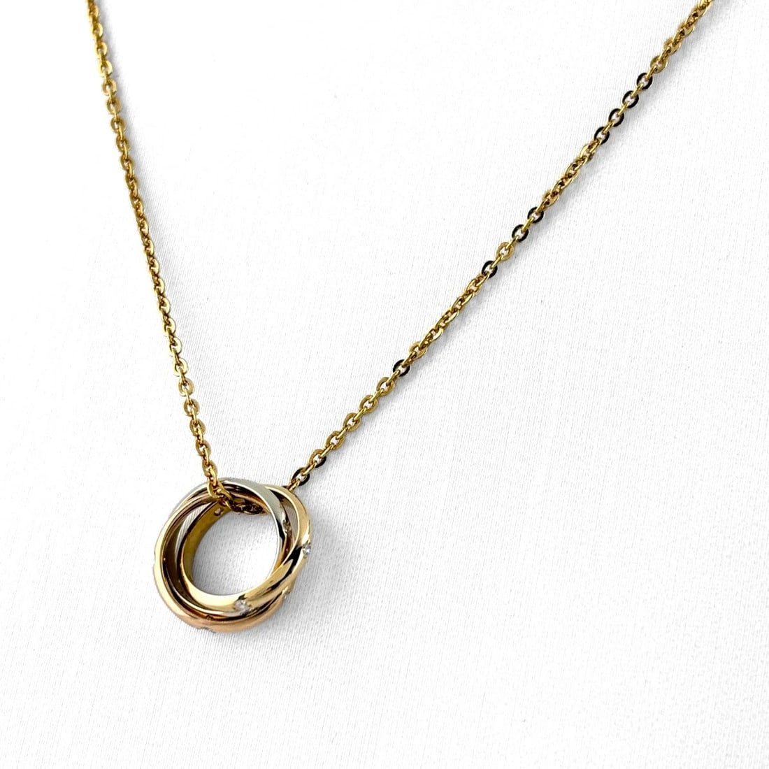 CARTIER BABY TRINITY 15-PIECE DIAMOND NECKLACE YG PENDANT: Cartier Baby Trinity 15-Piece Diamond Necklace Yg Pendant Brand: CARTIER Type/Style: Necklace Material: 750YG, Main Stone None Color: YG Size: 11.5x11.5mm(0.5") Accessories: None Accessories Notice: