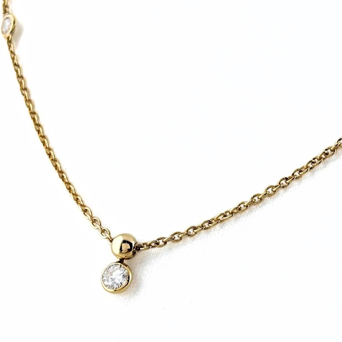 MELEE DIAMOND DESIGN NECKLACE YG PENDANT NECKLACE: Melee Diamond Design Necklace Yg Pendant Necklace Brand: Unbranded Type/Style: Necklace Material: 18K YG, Main Stone Natural Color: YG Size: 7.8x4.3mm(0.3") Accessories: None Accessories Notice: When