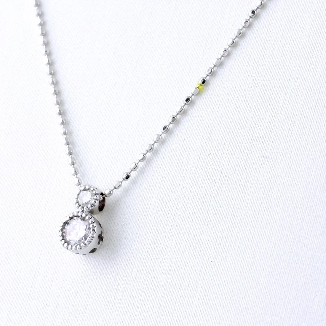 MELEE DIAMOND DESIGN NECKLACE WG PENDANT NECKLACE: Melee Diamond Design Necklace Wg Pendant Necklace Brand: Unbranded Type/Style: Necklace Material: 18K WG, Main Stone Natural Color: WG Size: 7.7x4.4mm(0.3") Accessories: None Accessories Notice: When
