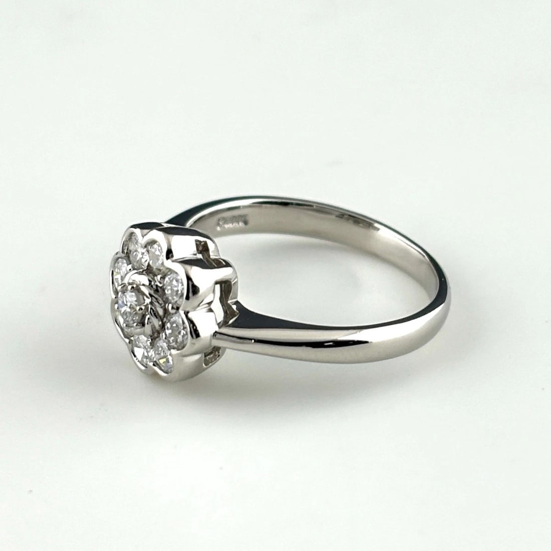FLOWER MOTIF DESIGN RING PLATINUM MELEE RING: Flower Motif Design Ring Platinum Melee Ring Brand: Unbranded Type/Style: Ring Material: Pt900, Main Stone Natural Color: None Size: US5.5 to 6 Accessories: None Accessories Notice: When purchasing