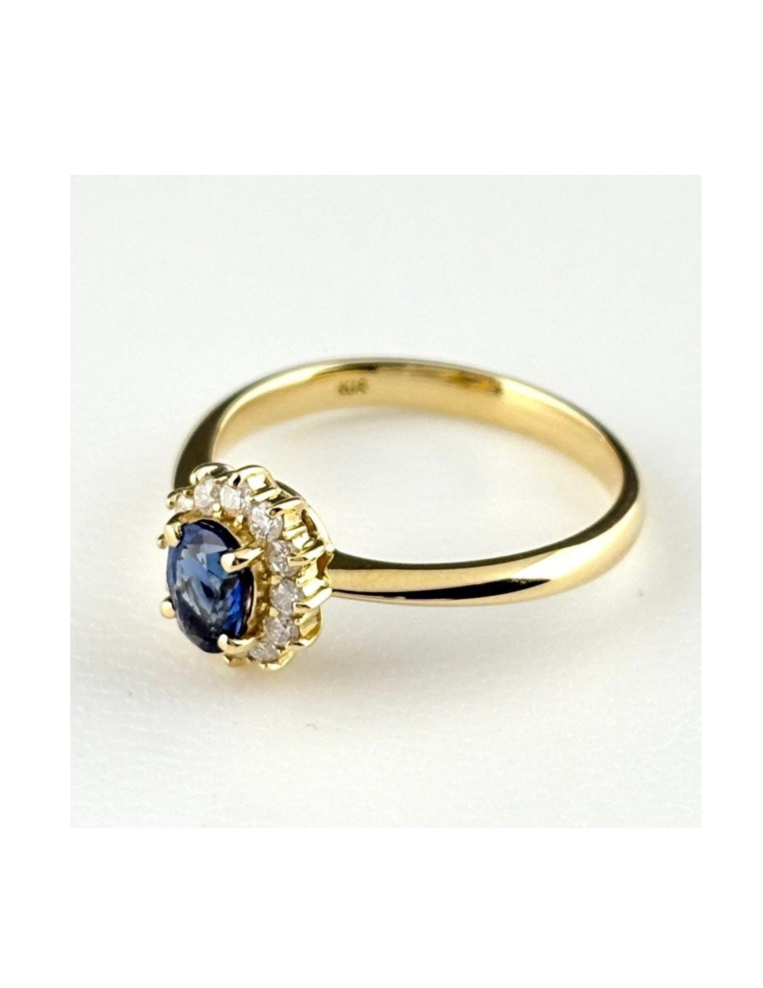SAPPHIRE DESIGN RING YG RING MELEE DIAMOND RING: Sapphire Design Ring Yg Ring Melee Diamond Ring Brand: Unbranded Type/Style: Ring Material: 18K YG, Main Stone Sapphire /Secondary Stone:Natural Color: YG Size: US6.5 Accessories: None Acc