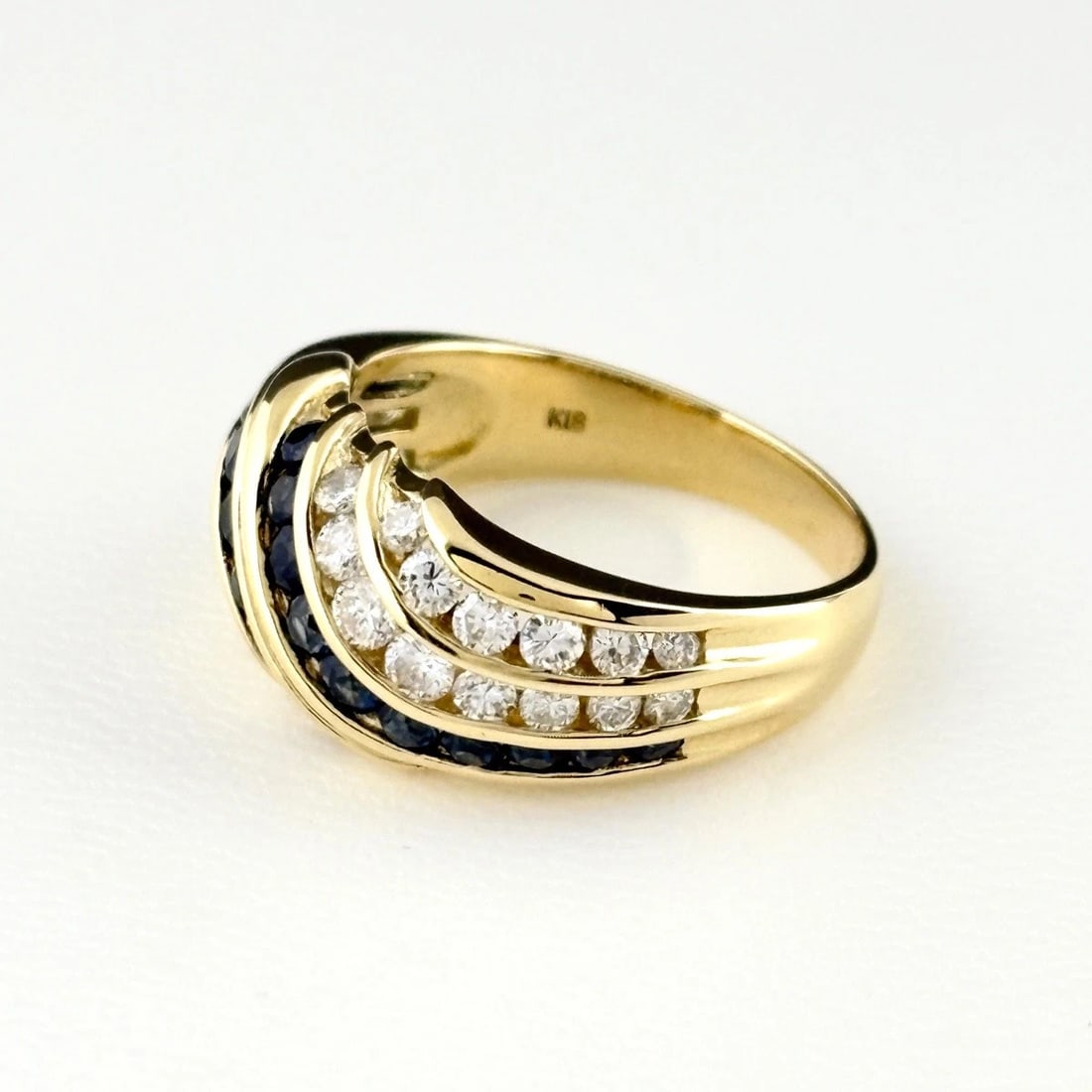 SAPPHIRE DESIGN RING YG MELEE DIAMOND RING: Sapphire Design Ring Yg Melee Diamond Ring Brand: Unbranded Type/Style: Ring Material: 18K YG, Main Stone Sapphire /Secondary Stone:Natural Color: YG Size: US6.5 to 7 Accessories: None Acc
