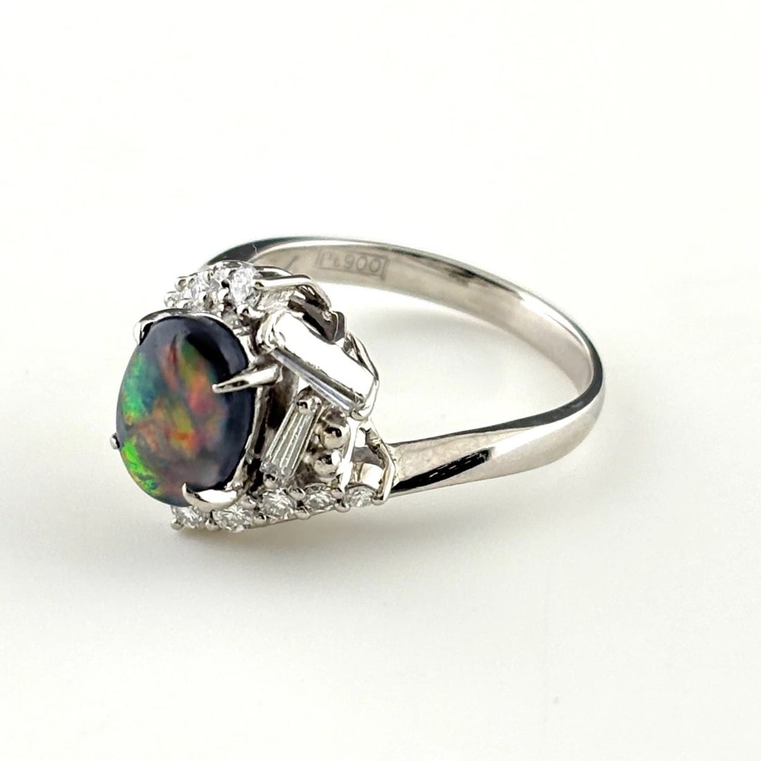 BLACK OPAL DESIGN RING PLATINUM MELEE RING: Black Opal Design Ring Platinum Melee Ring Brand: Unbranded Type/Style: Ring Material: Pt900, Main Stone Opal /Secondary Stone:Natural Color: None Size: US5 to 5.5 Accessories: None Accessories