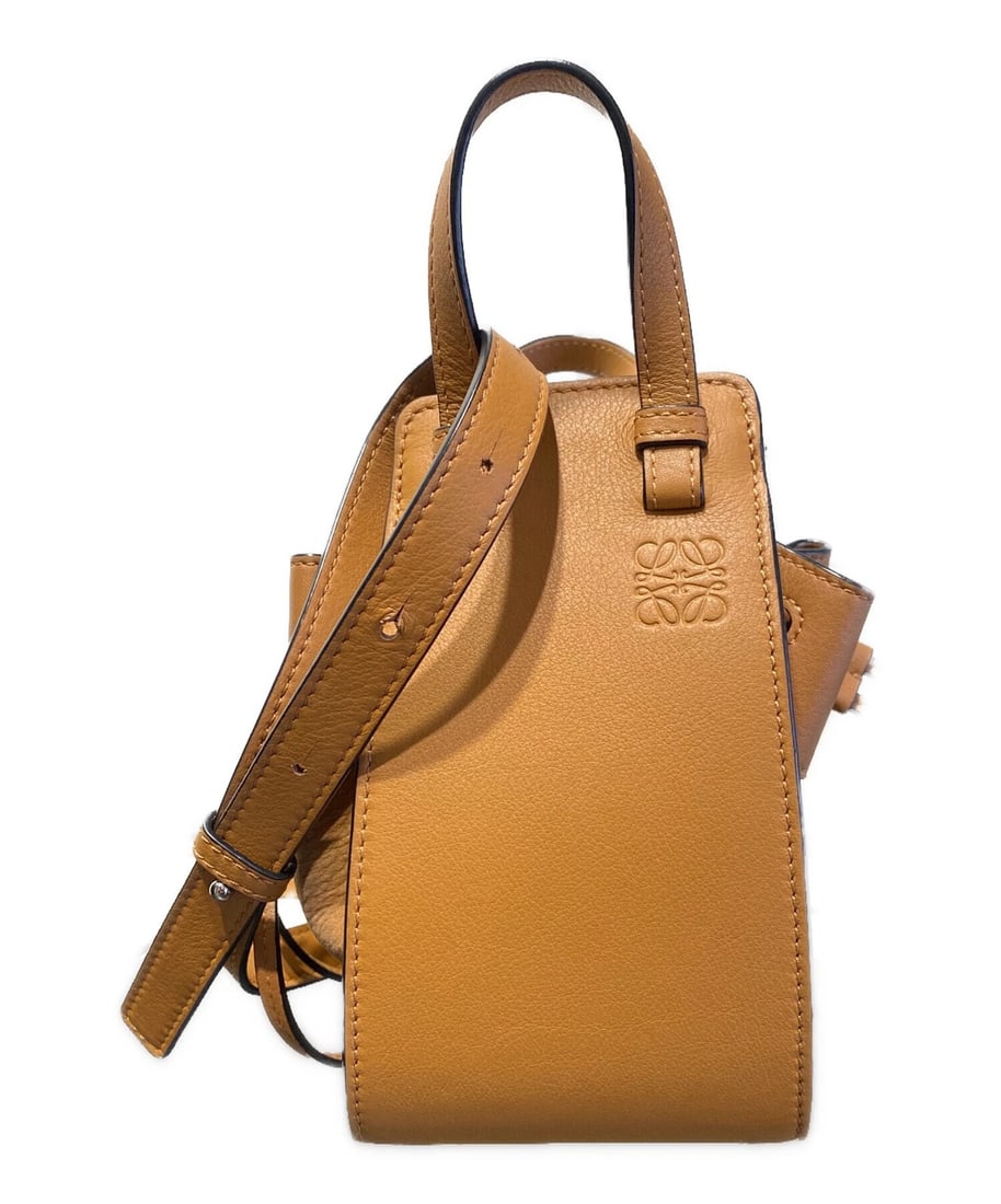 LOEWE HAMMOCK MINI SHOULDER BAG: LOEWE Hammock Mini Shoulder Bag Brand: LOEWE Type/Style: Shoulder Bag Material: Leather Color: Brown Size: Height: approx. 19 cm ( 7.48 in) Width: approx. 15 cm (5.91 in) Depth (Gusset): approx. 10.5 
