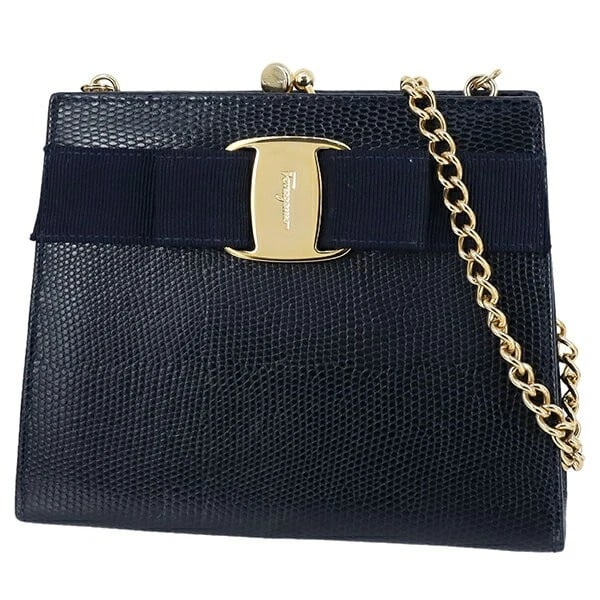SALVATORE FERRAGAMO VALA RIBBON HANDBAG: Salvatore Ferragamo Vala Ribbon Handbag Brand: Ferragamo Type/Style: 2Way Bag Material: Lizard-embossed leather Color: Navy Size: Approx.: Width 16cm x Height 13cm x Depth 5cm Accessories: None