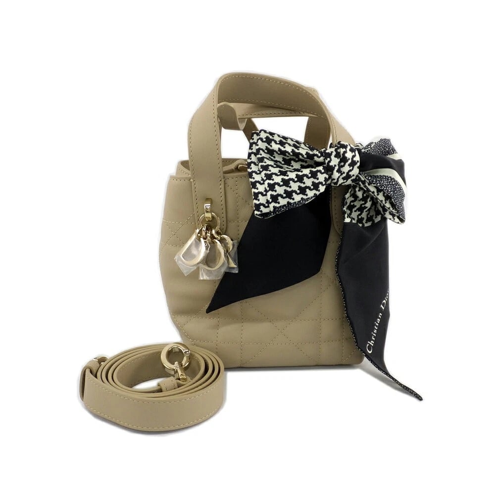 CHRISTIAN DIOR TOUJOURS VERTICAL NANO MACROCANNAGE LEATHER CROSSBODY BAG: Christian Dior Toujours Vertical Nano Macrocannage Leather Crossbody Bag Brand: Dior Type/Style: Shoulder Bag Material: Leather Color: Powder Beige Size: (W: approx. 14 cm, H: approx. 14 cm, D: