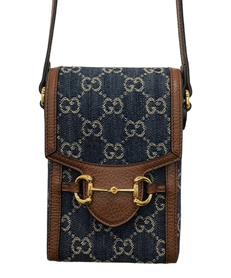 GUCCI MINI BAG HORSEBIT COLOR BROWN: Gucci Mini Bag Horsebit Color Brown Brand: GUCCI Type/Style: Shoulder Bag Material: None Color: Brown ? Blue Size: Height: approx. 7.1 in (18 cm) Width: approx. 4.3 in (11 cm) Depth: approx. 1.6 in