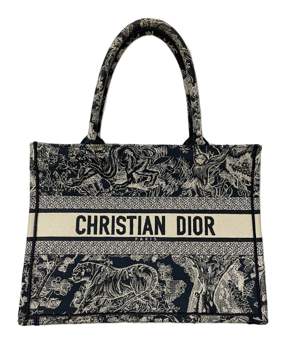CHRISTIAN DIOR BOOK TOTE BAG: Christian Dior Book Tote Bag Brand: Dior Type/Style: Tote Bag Material: Canvas Color: Navy Size: Handle Drop: approx. 16 cm ? 6.3 inches Height: approx. 28 cm ? 11.0 inches Width: approx. 35 cm ?