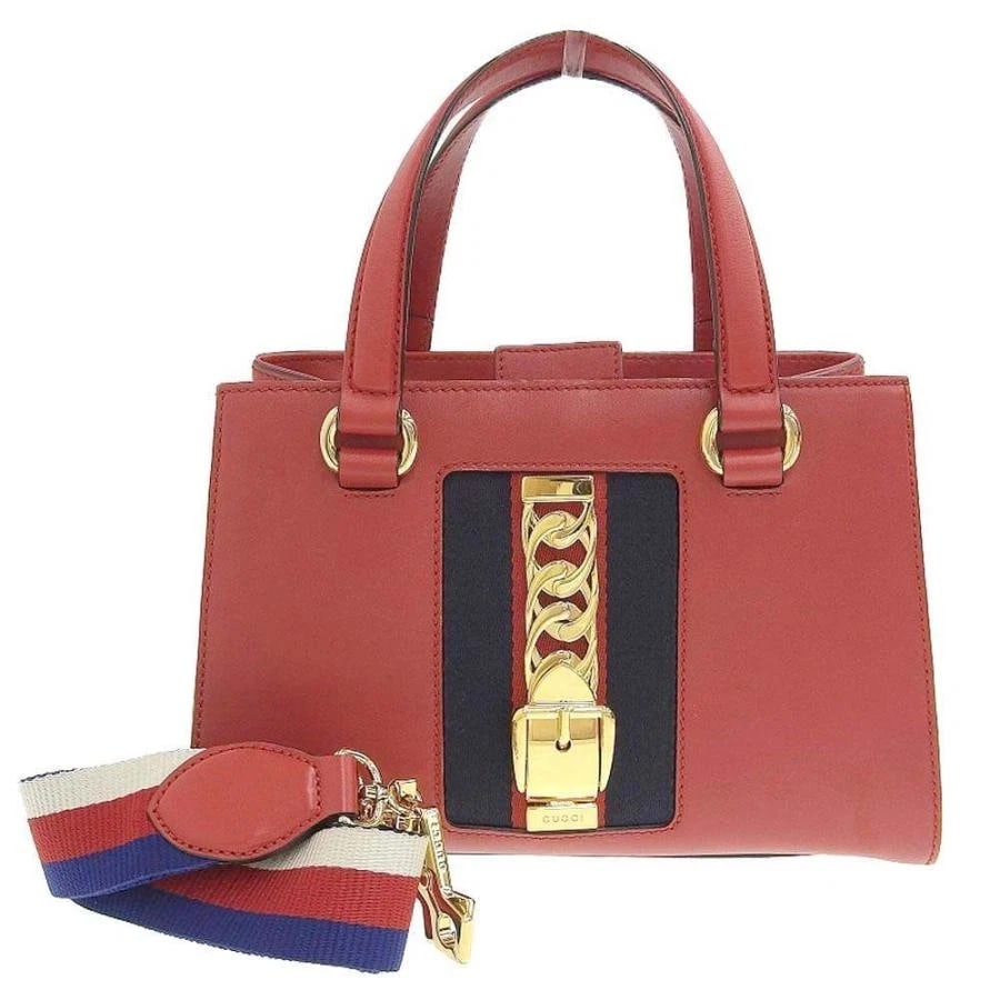 GUCCI BAG: SYLVIE RED: GUCCI Bag: Sylvie Red Brand: GUCCI Type/Style: Satchel/Top Handle Bag Material: Exterior Material Leather Color: Exterior Color Red Size: (approx. W10.4 ? H7.1 ? D4.1 inch) Accessories: None <