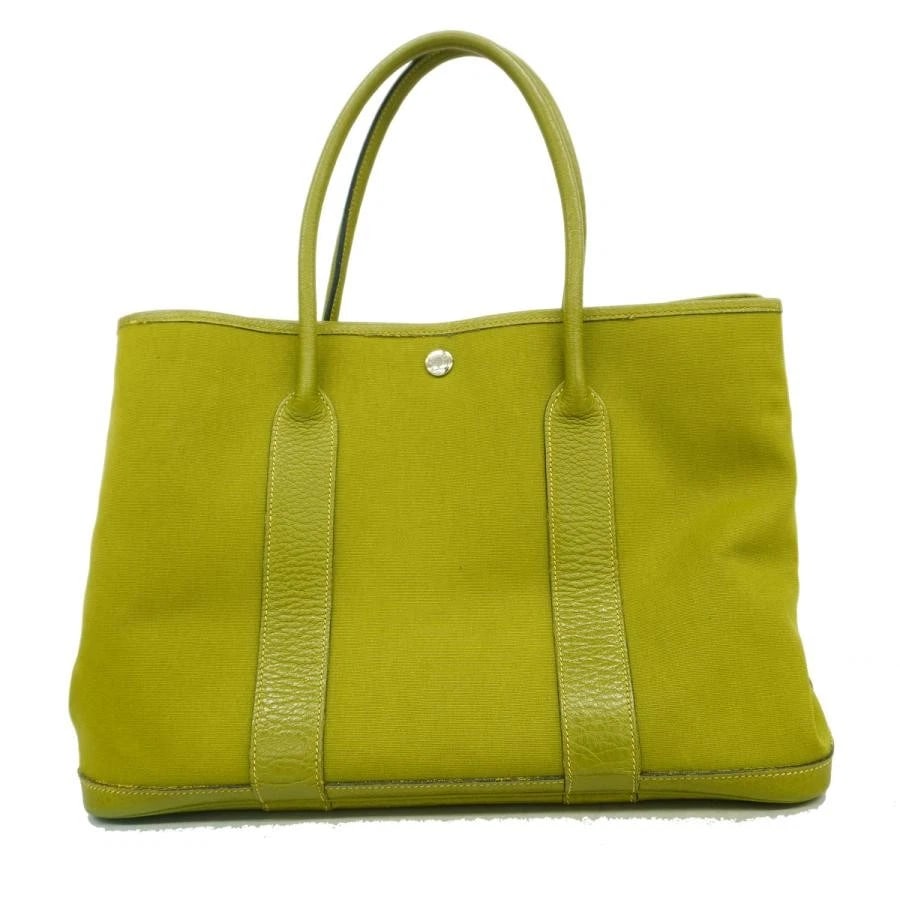 HERMES TOTE BAG: GARDEN PARTY PM GREEN: HERMES Tote Bag: Garden Party PM Green Brand: HERMES Type/Style: Tote Material: Exterior Material Canvas Color: Exterior Color Green Size: (approx. W14.2 ? H10.4 ? D6.9 inch) Accessories: None