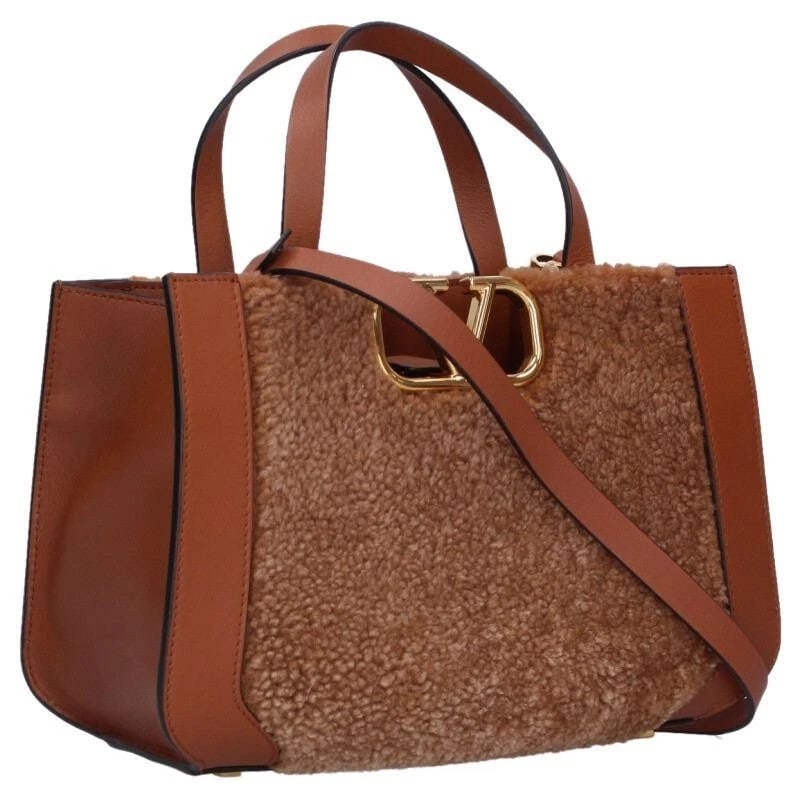 VALENTINO GARAVANI BAG: V LOGO SHEARLING BROWN: VALENTINO GARAVANI Bag: V Logo Shearling Brown Brand: Valentino Garavani Type/Style: Satchel/Top Handle Bag Material: Exterior Material Fur Color: Exterior Color Brown Size: (approx. W10.4 ? H6.7 ? D3
