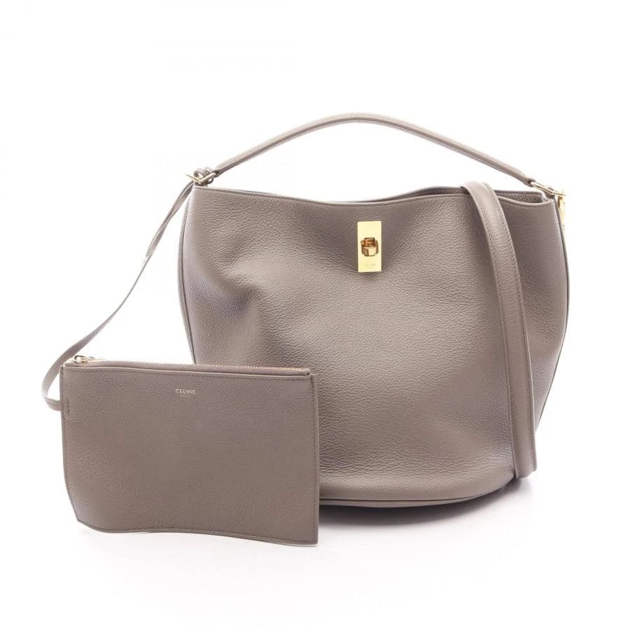 CELINE BAG: BUCKET W/STRAP POUCH: CELINE Bag: Bucket w/strap pouch Brand: CELINE Type/Style: Top Handle Bag Material: Exterior Material Leather Color: Exterior Color Beige Size: (approx. W9.1 ? H9.4 ? D9.1 inch) Accessories: None
