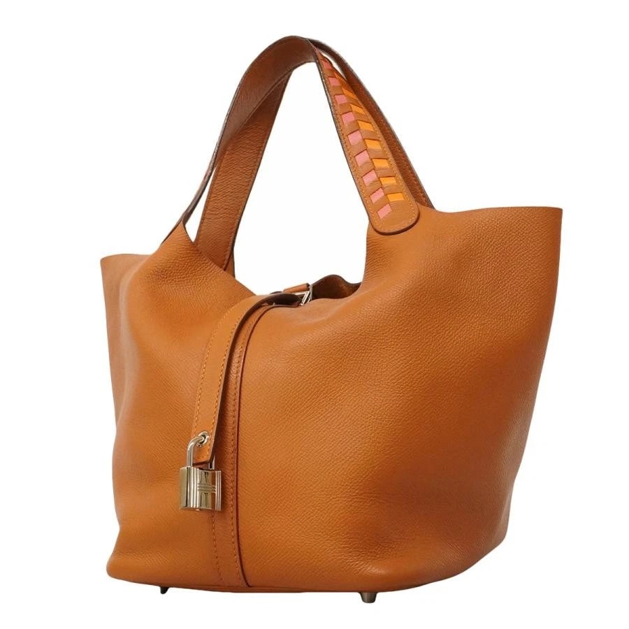 HERMES BAG: PICOTIN LOCK MM TRESAGE D STAMP GOLD: HERMES Bag: Picotin Lock MM Tresage D stamp Gold Brand: HERMES Type/Style: Top Handle Bag Material: Exterior Material Leather Color: Exterior Color Gold Size: (approx. W6.7 ? H8.3 ? D8.7 inch)