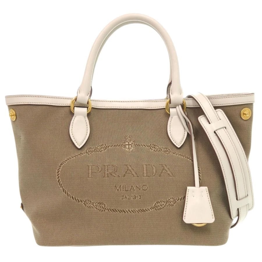 PRADA BAG: LOGO JACQUARD: PRADA Bag: LOGO JACQUARD Brand: PRADA Type/Style: Shoulder Bag Material: Exterior Material Leather / Jacquard Color: Exterior Color Beige Size: (approx. W9.8 ? H8.1 ? D5.7 inch) Accessories: None