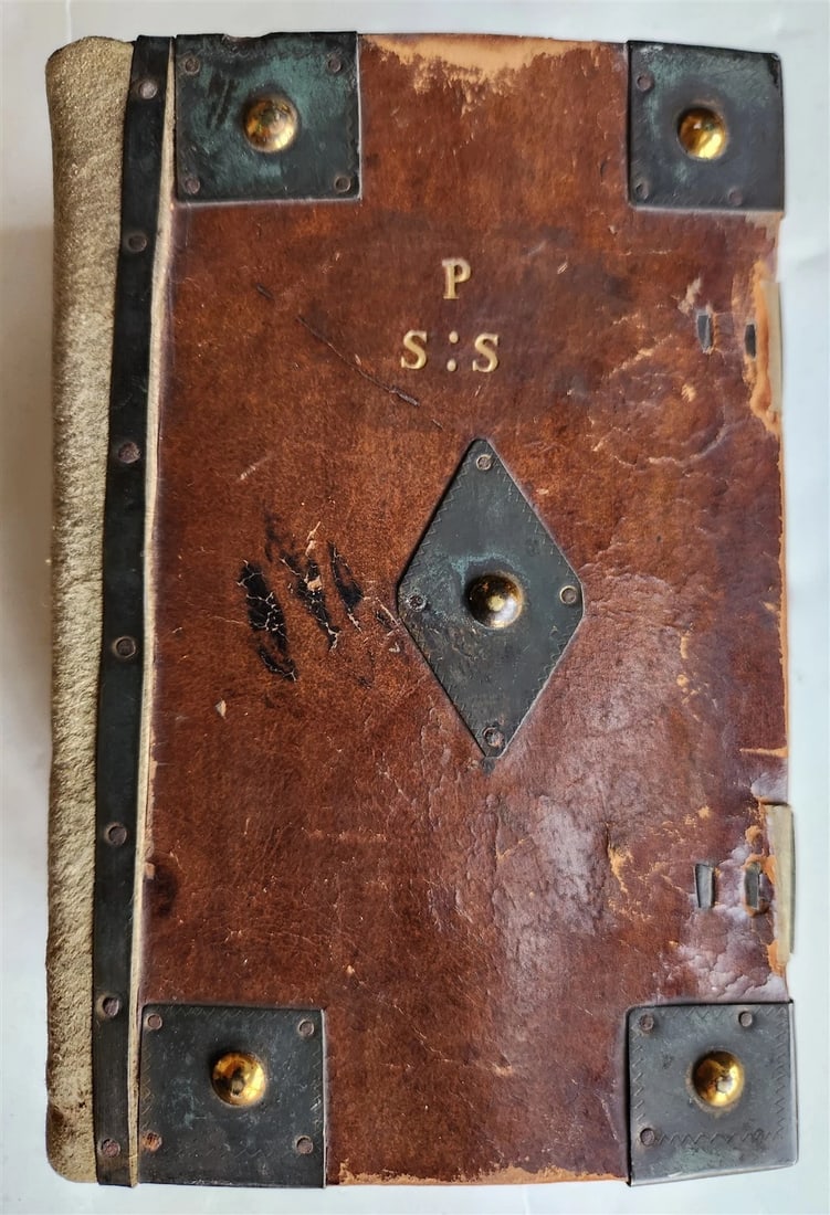 1801 ENGLISH COMMON PRAYER BOOK WITH ANTIQUE METAL FITTINGS AND CLASPS: Year/Century: 19th century Language: English Subject: Religion & Spirituality Binding: Leather Description: THE BOOK OF COMMON PRAYER, OXFORD: DAWON, BENSLEY AND COOKE, 1801, 5 by 7 1/2" The spine was