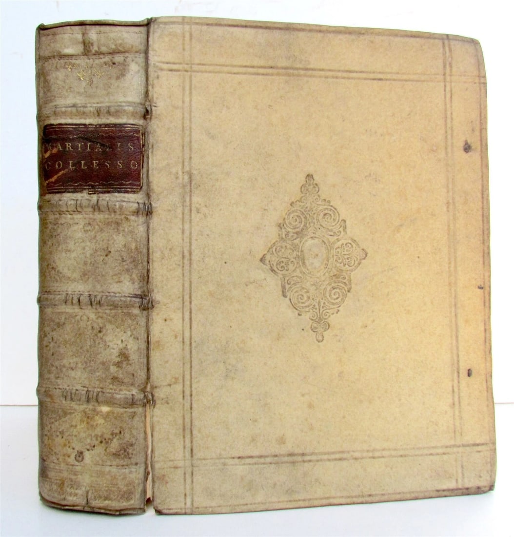 VALERII MARTIALIS' 1680 EPIGRAMMATUM VELLUM BINDING: Year/Century: 17th century Language: Latin Subject: Literature & Fiction Binding: Vellum Description: M. Valerii Martialis Epigrammatum Libros XV; Paris, Antonium Cellier; 1680; original vellum boards