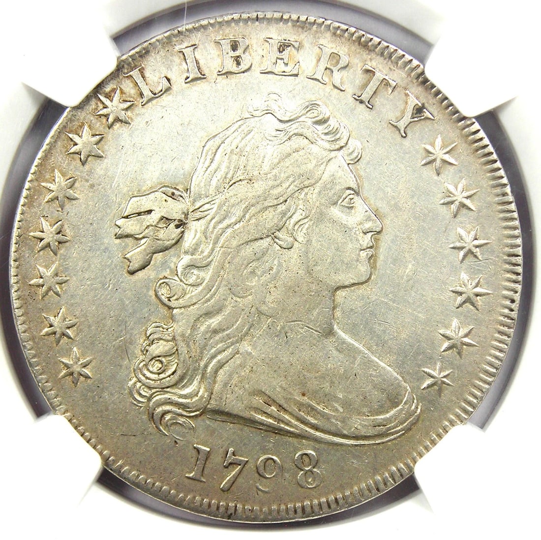 1798 DRAPED BUST SILVER DOLLAR $1 COIN: 1798 Draped Bust Silver Dollar $1 Coin Year: 1798 Denomination: $1 Country of Origin: United States Accessories: None Accessories Notice: When purchasing pre-owned goods, please refer to the photos
