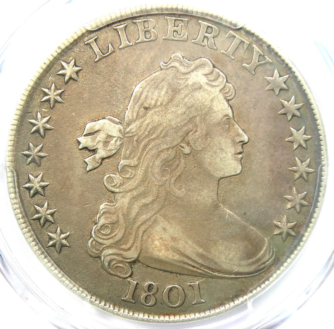 1801 DRAPED BUST SILVER DOLLAR $1 COIN: 1801 Draped Bust Silver Dollar $1 Coin Year : 1801 Denomination : $1 Country of Origin : United States Accessories: None Accessories Notice: When purchasing pre-owned goods, please refer to the