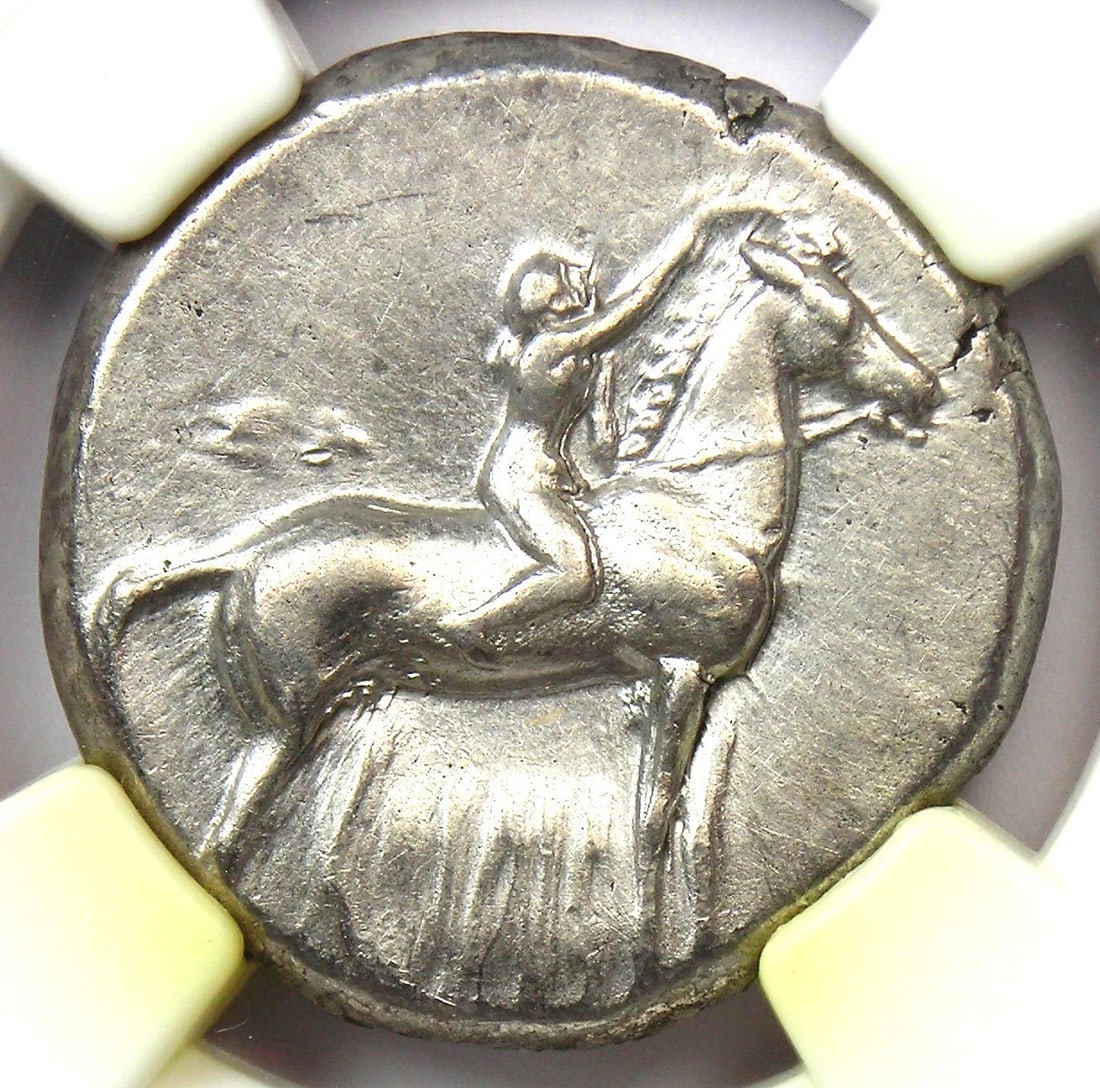 CALABRIA TARAS AR DIDRACHM SILVER DOLPHIN HORSE COIN: Calabria Taras AR Didrachm Silver Dolphin Horse Coin Year: 302 BC Denomination: Didrachm Country of Origin: Italy Accessories: None Accessories Notice: When purchasing pre-owned goods, please refer to