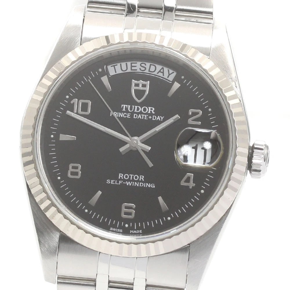 TUDOR PRINCE DATE WG BEZEL BLACK AUTOMATIC WATCH: TUDOR Prince Date WG bezel Black Automatic Watch Brand: TUDOR Type/Style: Wristwatch Material: Band Material Stainless Steel, Case Material Stainless Steel/K18WG Color: Dial Color black Size: Case