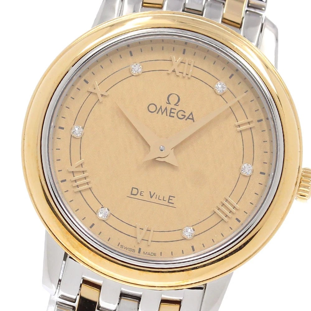 OMEGA DE VILLE PRESTIGE QUARTZ WATCH: OMEGA De Ville Prestige Quartz Watch Brand: OMEGA Type/Style: Wristwatch Material: Band Material Stainless Steel/YG, Case Material Stainless Steel/YG Color: Dial Color gold Size: Case Size About27mm
