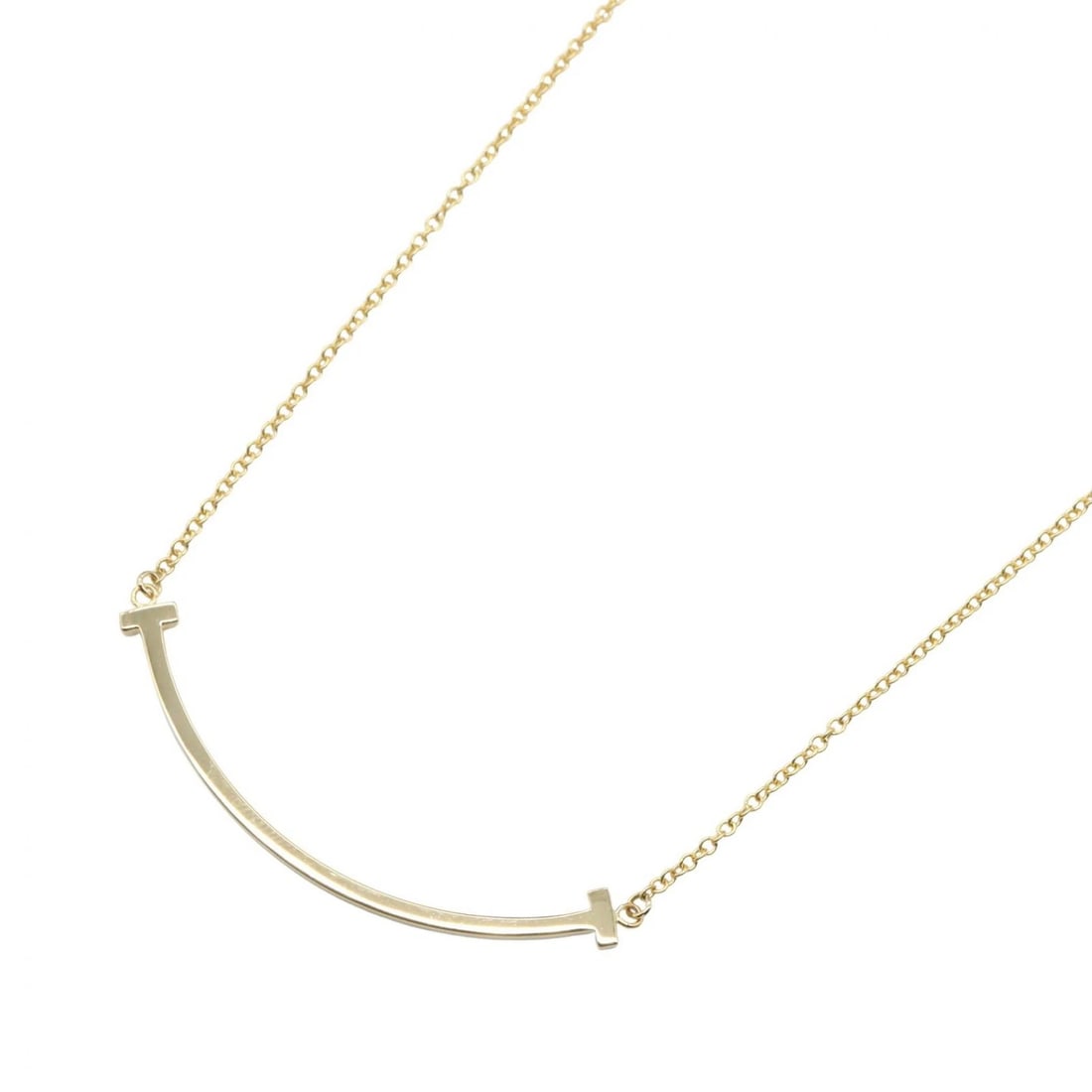 TIFFANY?CO T SMILE SMALL NECKLACE PENDANT: TIFFANY?CO T Smile Small Necklace Pendant Brand: TIFFANY?CO Type/Style: Necklace Material: K18 (Yellow Gold), Color: Gold Size: Size Neck rotation?40.5/45.5cm(15.9") Motif W?37mm x H?3mm(1.5" x 0.1")