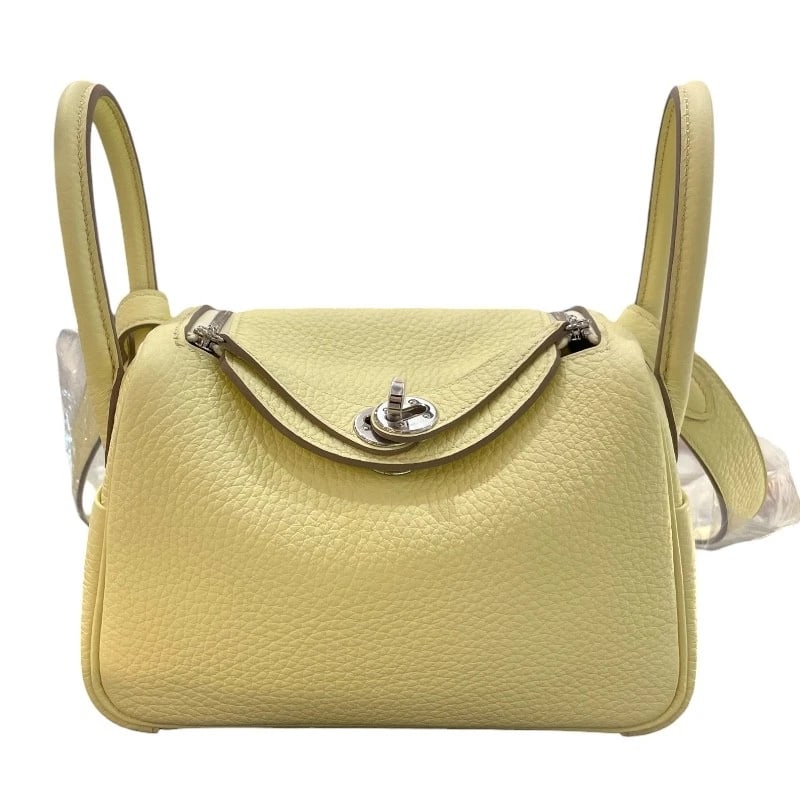 HERMES LINDY MINI SHOULDER BAG: HERMES Lindy mini Shoulder Bag Brand: HERMES Type/Style: Shoulder Bag Material: Taurillon Clemence Color: Jaune Milton SilverHardware Size: W7.1 x H4.9x D3.5inch Shoulder:36.2inch Accessories: Non