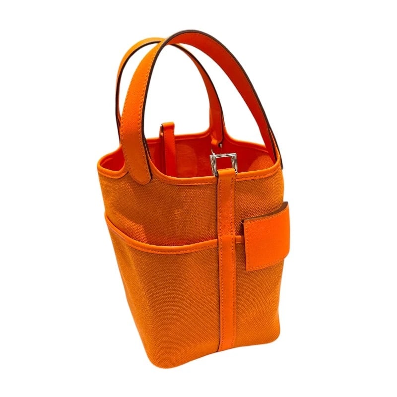 HERMES PICOTAN LOCK PM CARGO HANDBAG: HERMES Picotan Lock PM Cargo Handbag Brand: HERMES Type/Style: Handbag Material: Swift/Toile Elan Color: Orange Size: W7.1 x H7.5x D5.1inch Accessories: None Accessories Notice: When purch