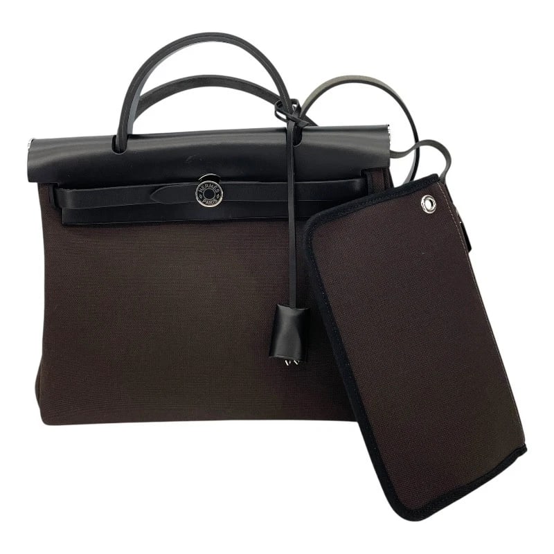 HERMES HERBAG ZIP PM HANDBAG: HERMES Herbag Zip PM Handbag Brand: HERMES Type/Style: Handbag Material: Toile/leather Color: Dark Brown SVHardware Size: W11.8 x H9.8x D3.9inch Accessories: None Accessories Notice: When purchasing