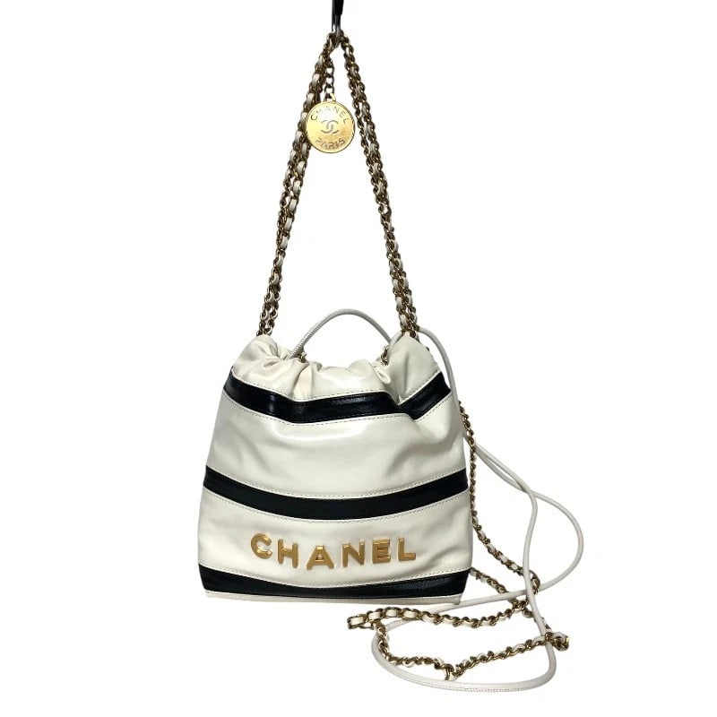 CHANEL MINI HANDBAG: CHANEL mini Handbag Brand: CHANEL Type/Style: Handbag Material: shiny calf Color: White/Black/GoldHardware Size: W7.1 x H6.9x D2.4inch Accessories: None Accessories Notice: When purchasing