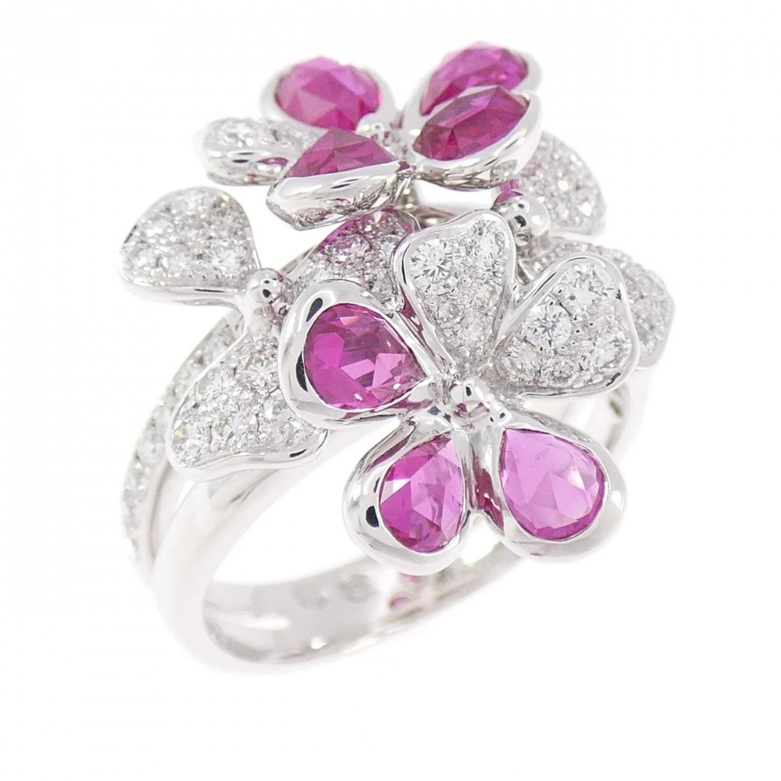 K18WG FLOWER RUBY RING: K18WG Flower Ruby Ring Brand: Unbranded Type/Style: Ruby Ring Material: K18 white gold, Main Stone Ruby, Natural Color: WG Size: US8 1/4 Accessories: None Accessories Notice: When purchasing