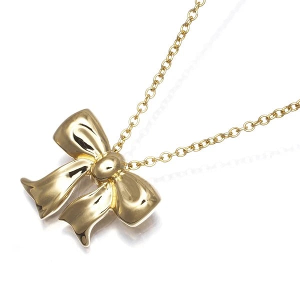 TIFFANY&CO. NECKLACE RIBBON 18K 750 YELLOW GOLD: Tiffany&Co. Necklace Ribbon 18K 750 Yellow Gold Brand: Tiffany & Co. Type/Style: Necklace Material: 18K /750 Yellow Gold, Color: Yellow Gold Size: Necklace length: 42cm Pendant size: 11.0 x 13.0mm