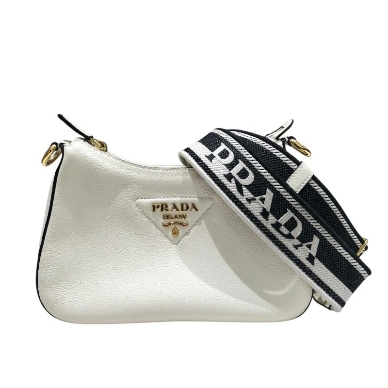 PRADA VITELLO DINOSOFT SHOULDER BAG: PRADA Vitello Dinosoft Shoulder Bag Brand: PRADA Type/Style: Shoulder Bag Material: leather Color: white Size: W9.8 x H6.7x D2.8inch Shoulder:45.7inch Accessories: None Accessories Notice: When